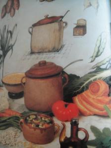 A soup tureen and vegetables