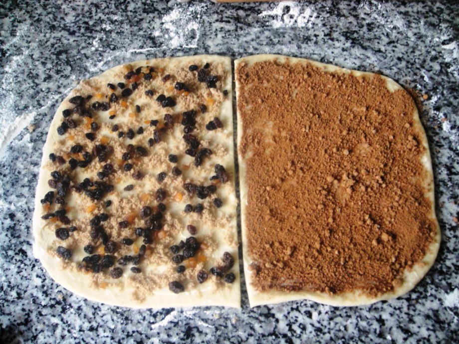 Chelsea and cinnamon bun dough with filling spread on it