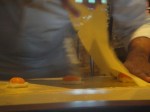 Laying the pasta over the egg yolks