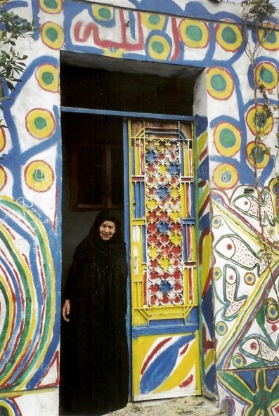 Lady at the door of her house
