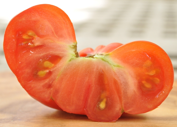 Home-grown tomato cut in half