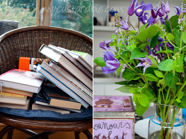 books on a chair, tin and flowers in the kitchen