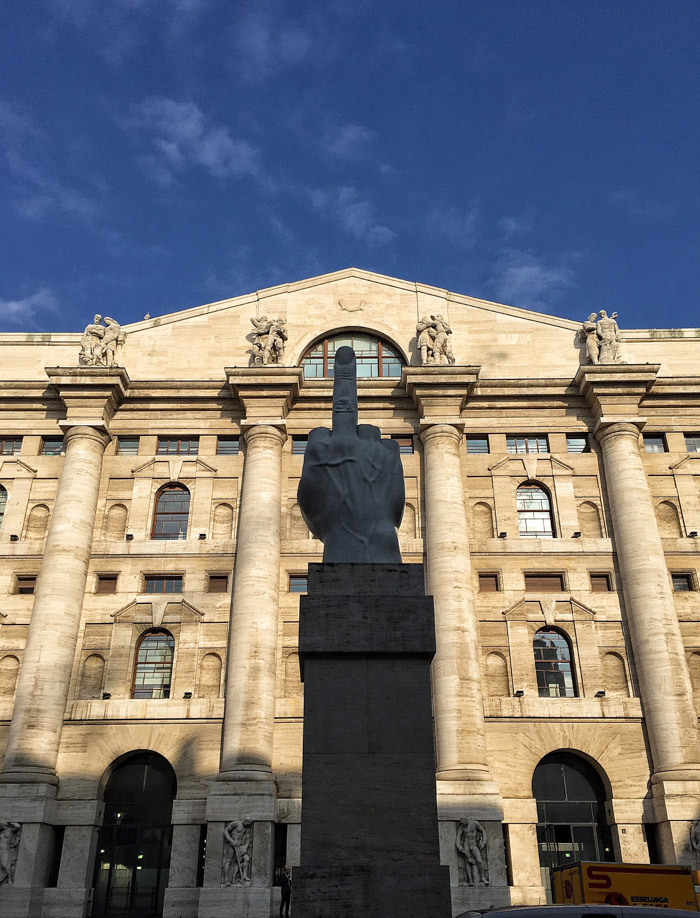 L.O.V.E. statue outside the stock exchange in in Milan Italy. Read more on mycustardpie.com