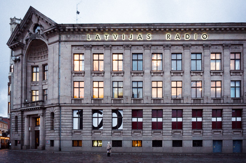 Large building with lights reflected in windows