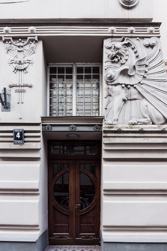 griffen detail by brown door on art nouveau style house in riga latvia