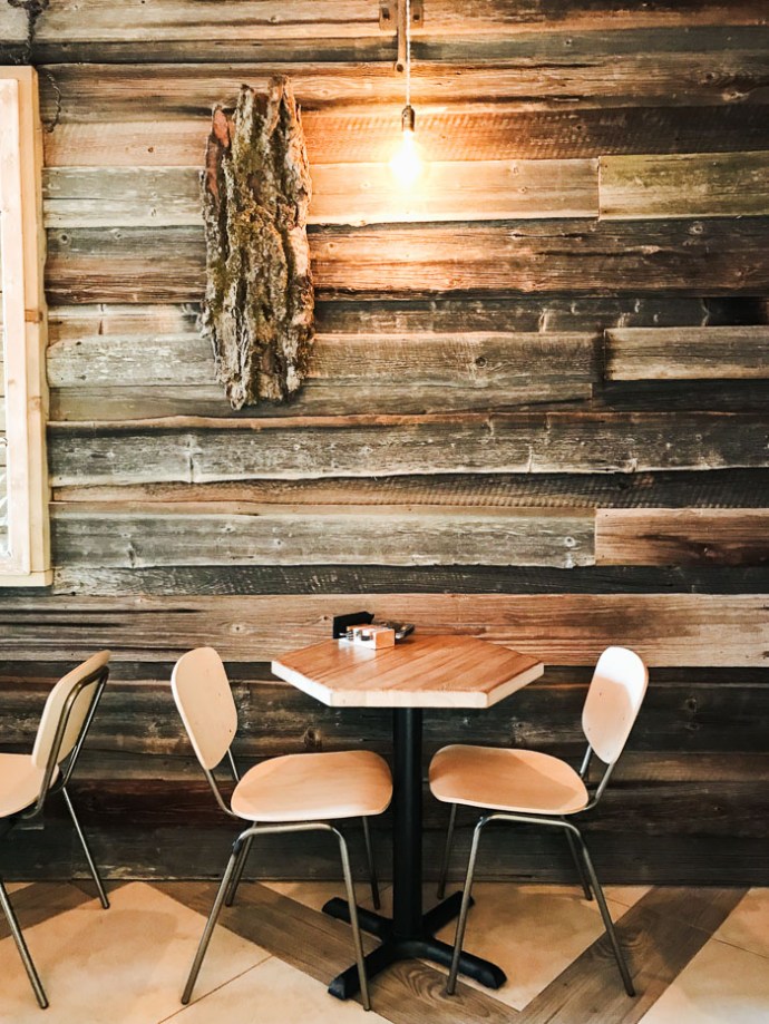 Wooden table and chairs in cafe Riga