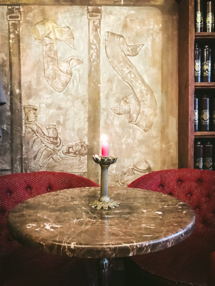 candle on a table in cafe in riga