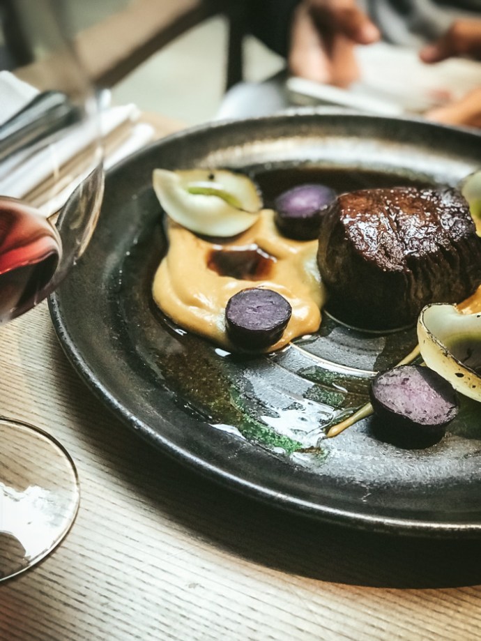 Meat on a black plate