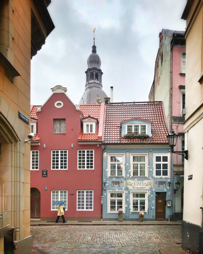 A pink and a blue building in Riga