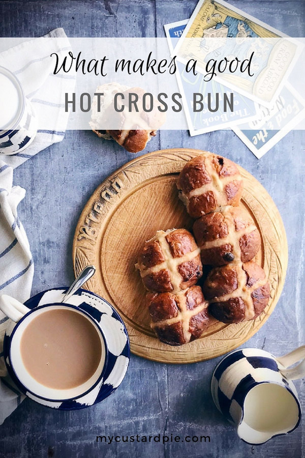 hot cross buns on a bread board