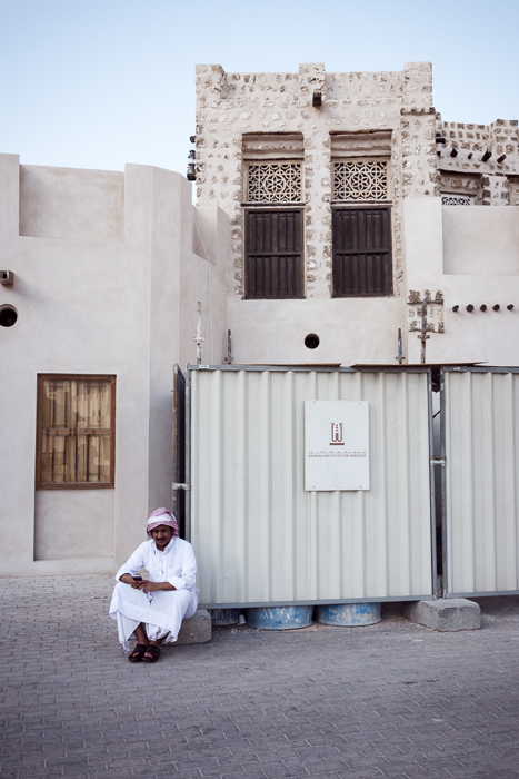 man by historic building