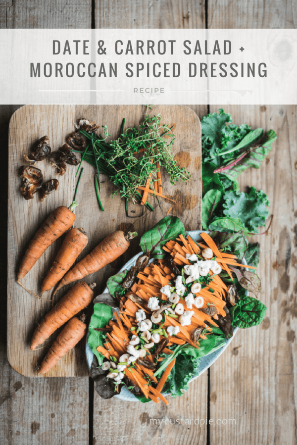 A chopping board with carrots, herbs and a plate of date and carrot salad