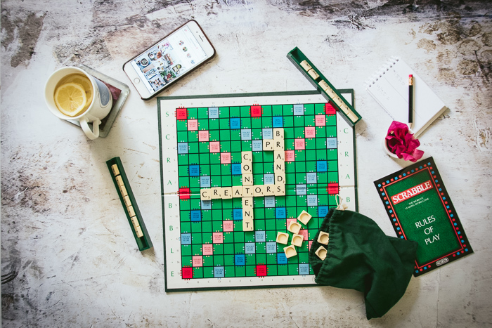 Scrabble board, cup of tea, phone