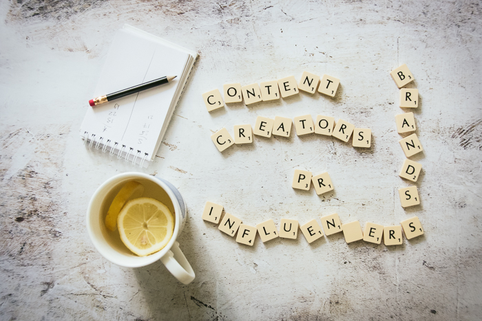 Scrabble letters, a cup of tea and a notepad