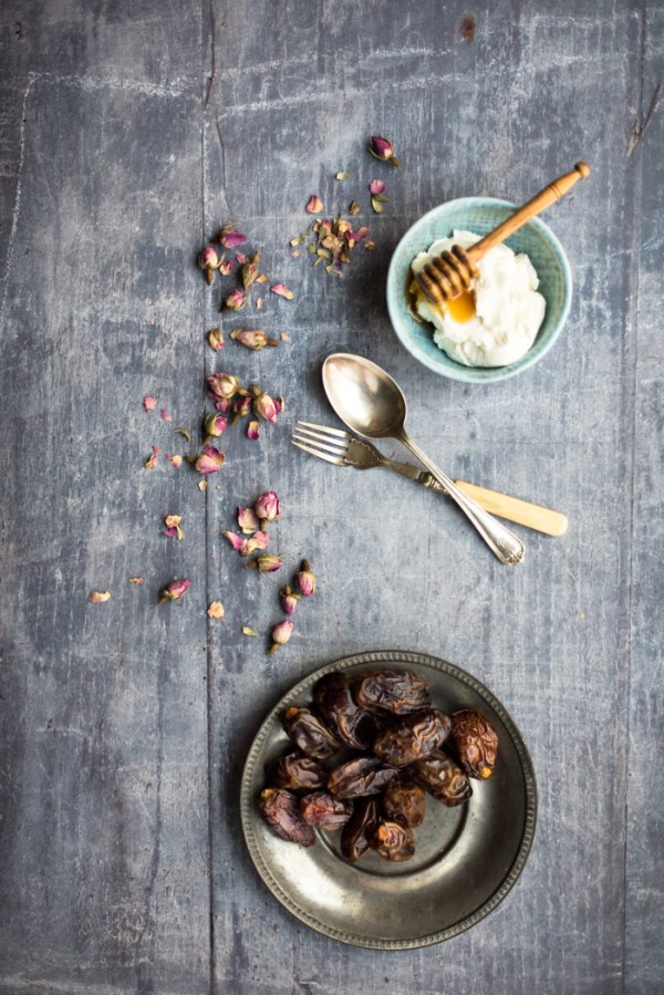 Bowl of yoghurt and a plate of dates
