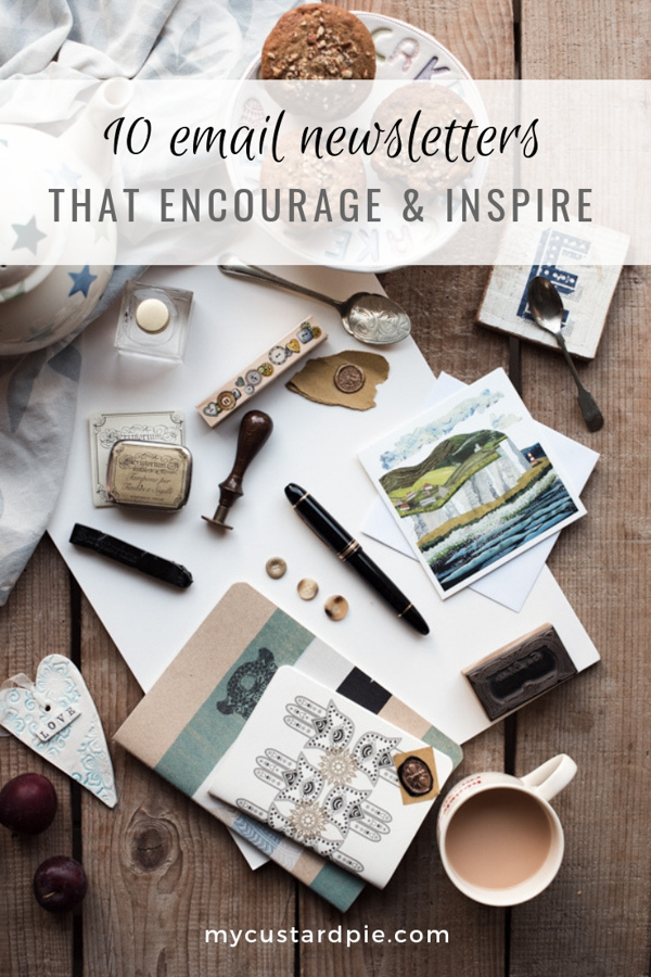 Pens, paper and notebooks for writing a newsletter plus teapot, tea and muffins