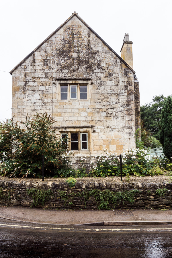 Cotswold stone house in the rain