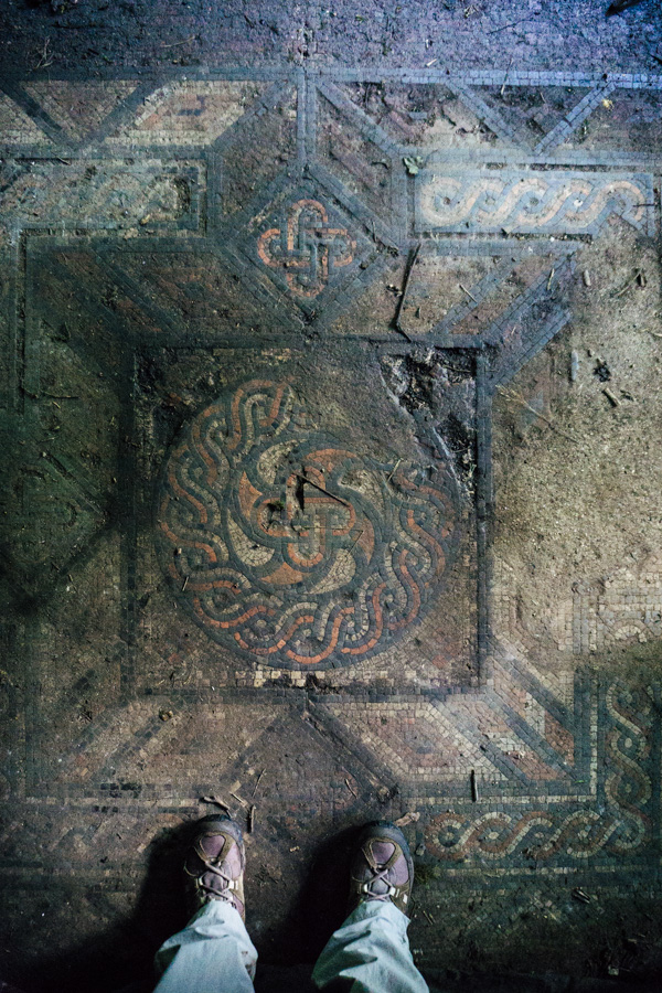 walking boots by a Roman mosaic