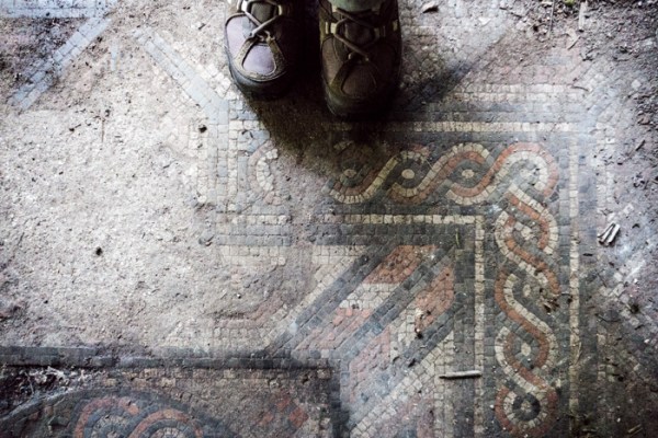 Walking boots by a Roman mosaic