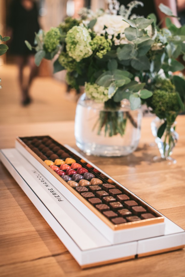 A box of Pierre Marcolini chocolates and a vase