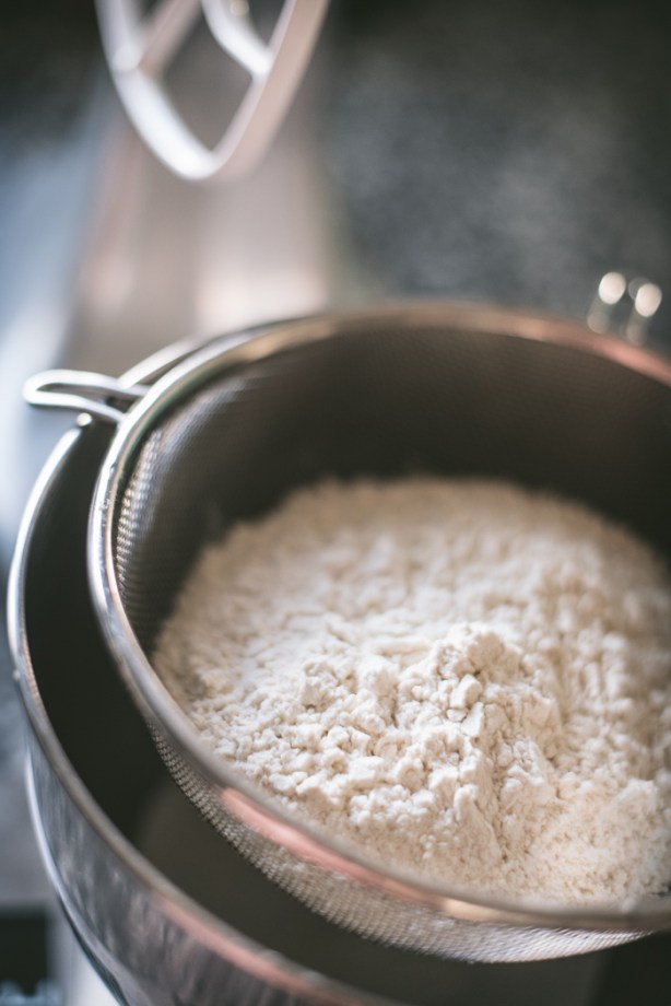 flour in a seive for gingerbread making
