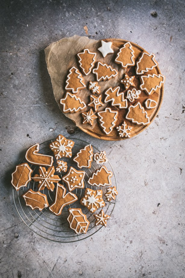 gingerbread biscuits on a wooden board and cooling rack