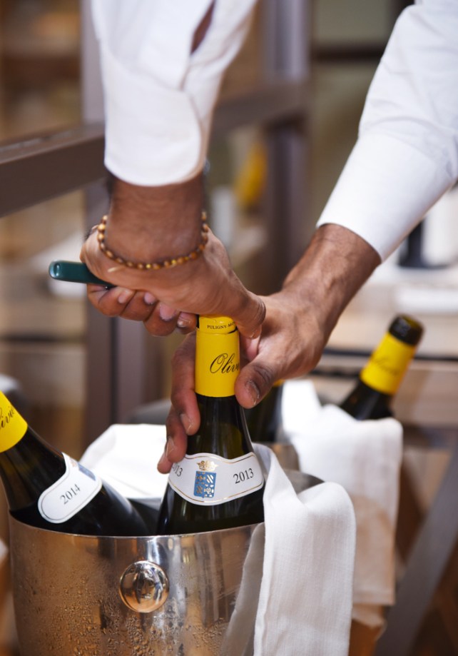 Olivier Leflaive bottle of white Burgundy being opened