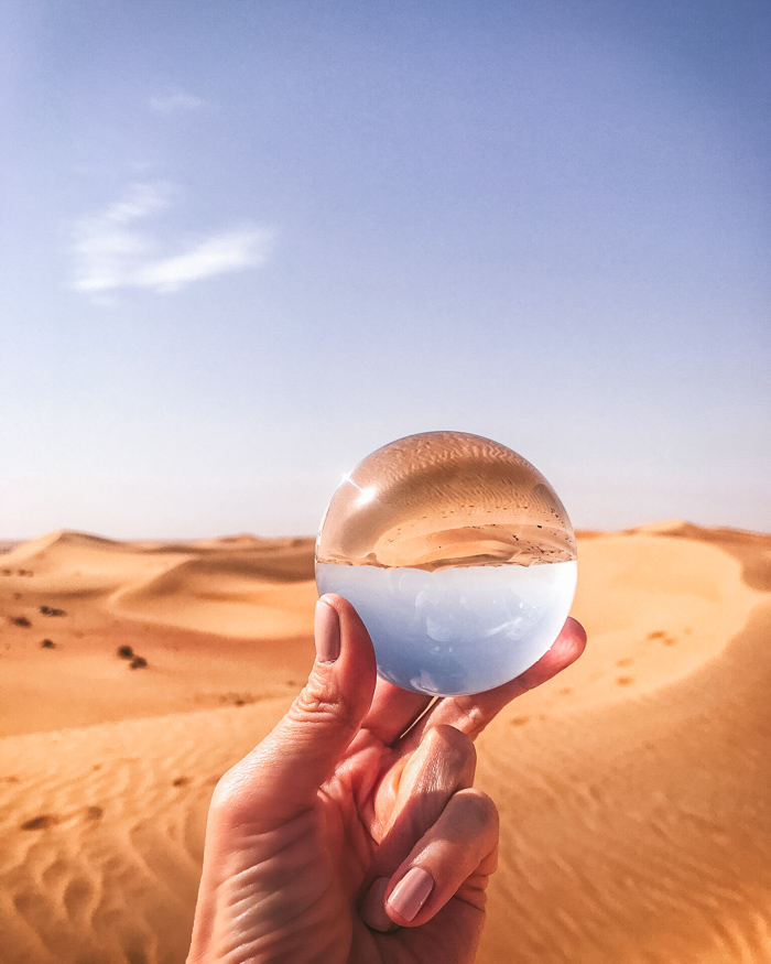 a lensball reflecting the desert