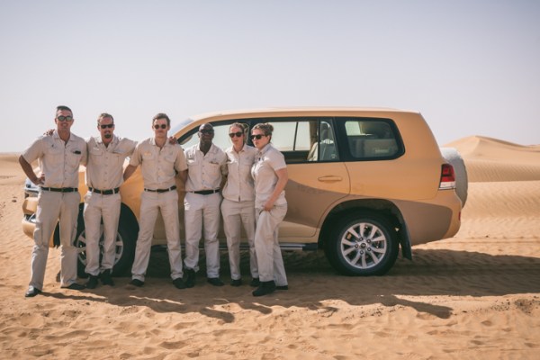 rangers in the desert in front of four wheel drives