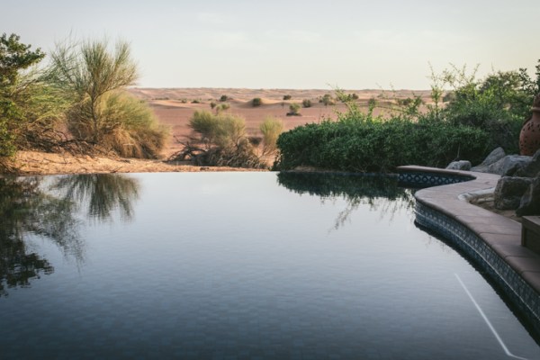 The view over private infinity pool into the desert