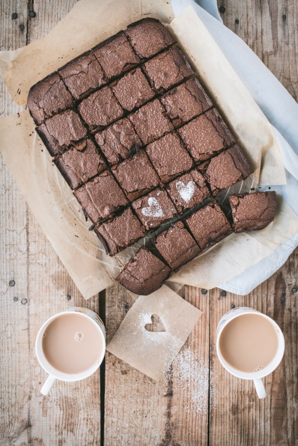 Chocolate brownies and two cups of tea