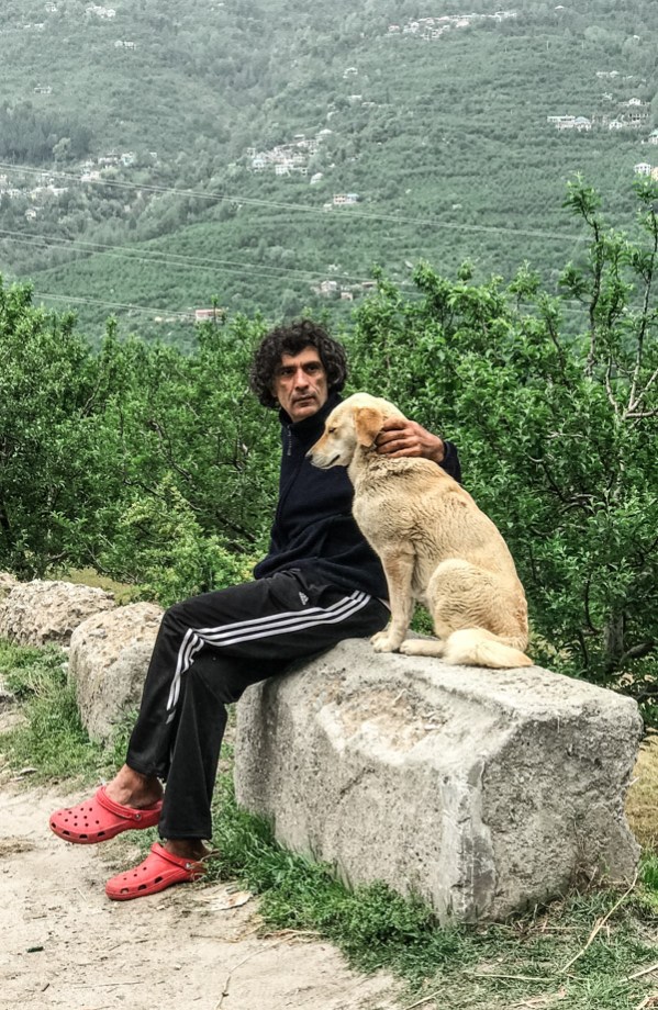 Our yoga teacher and his adopted dog