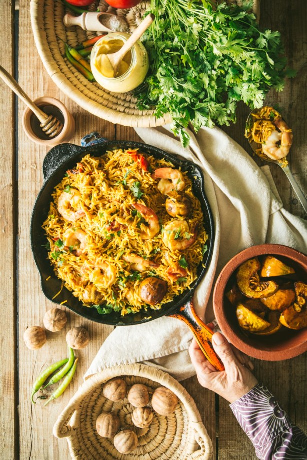skillet with rice and honey mustard prawns with ingredients coriander and loumi