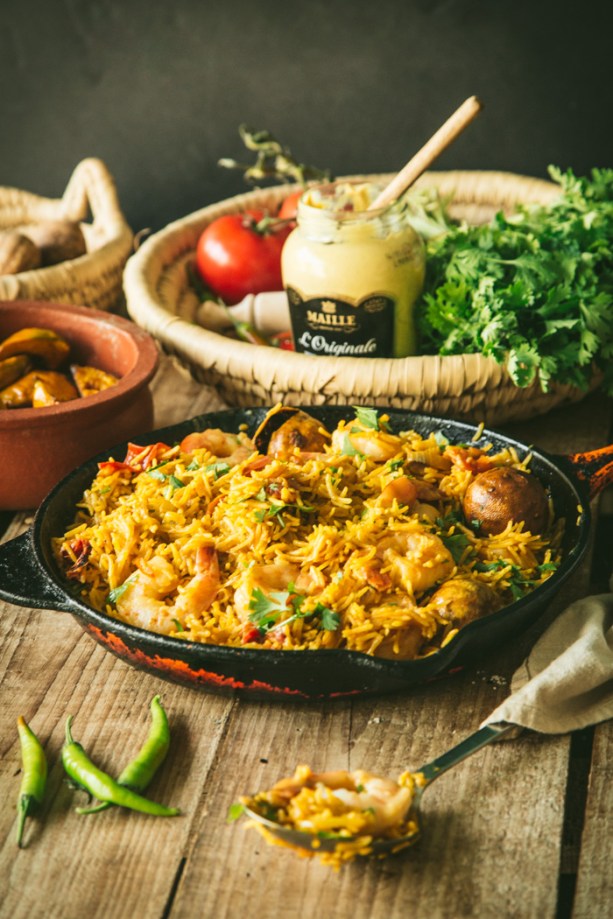 skillet with rice and honey mustard prawns with ingredients coriander and loumi