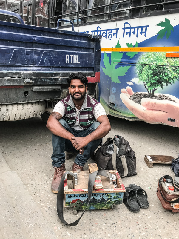 man and shoe shine kit