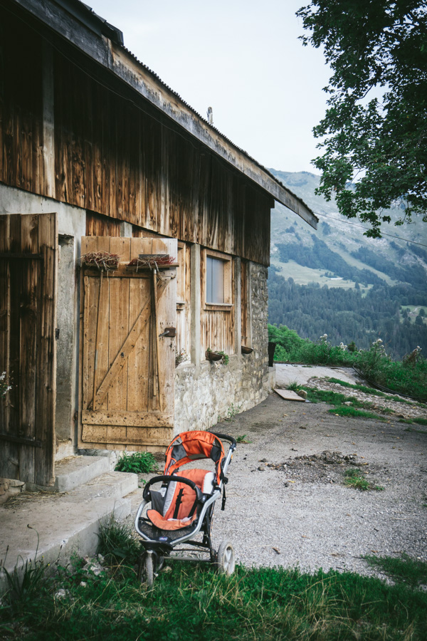 pushchair in front of cow shed