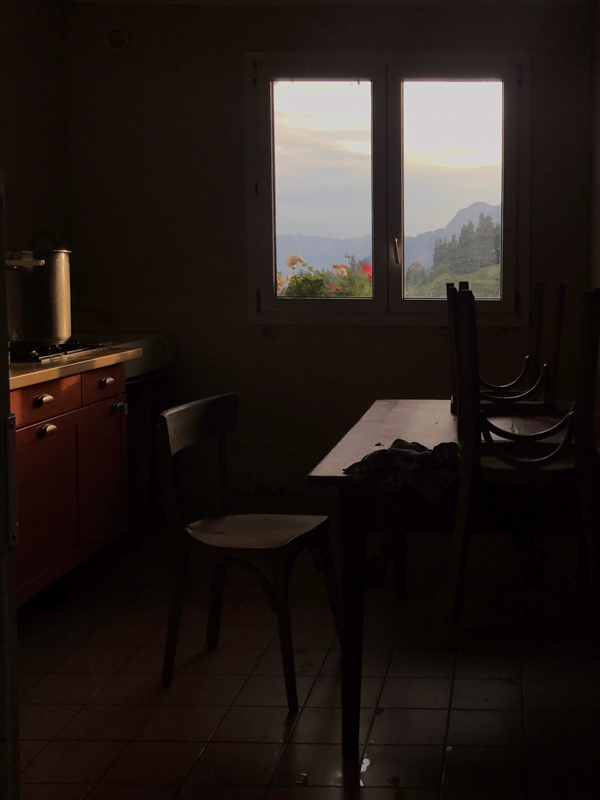 view of the mountains through the kitchen window