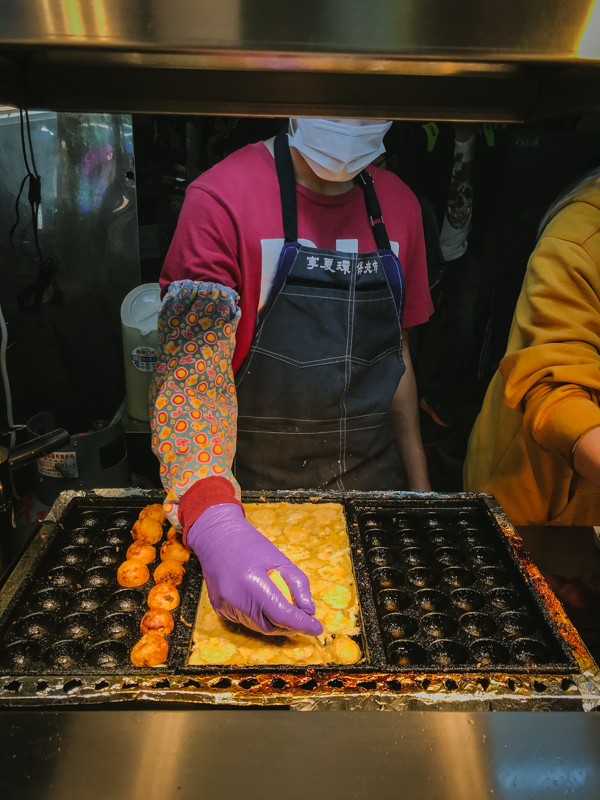 man making octopus balls