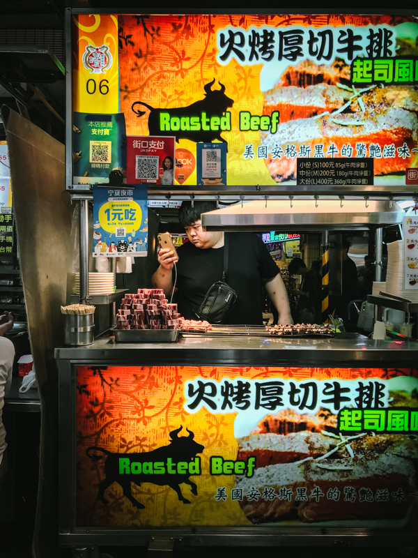 man at street food stall