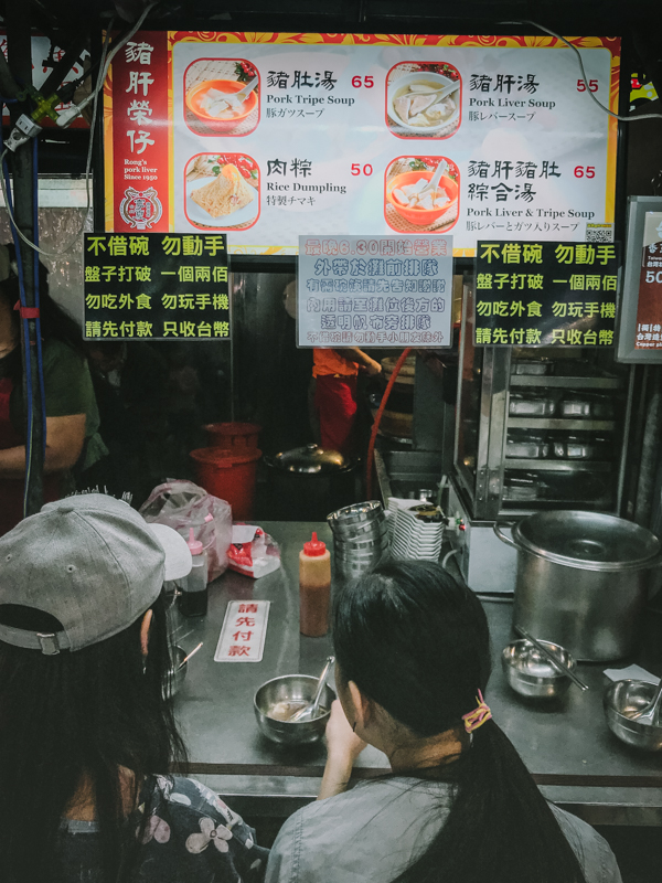 women at street food stall