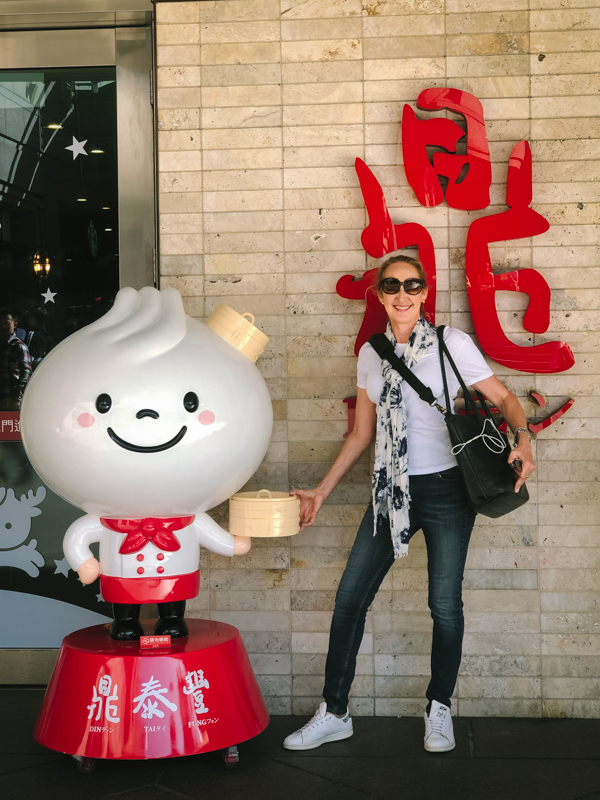 woman standing with cartoon character