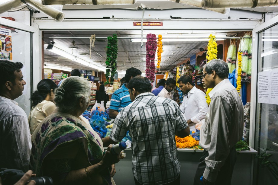 people buying garlands of flowers for Diwali