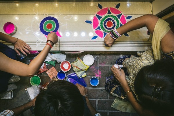 people making rangoli
