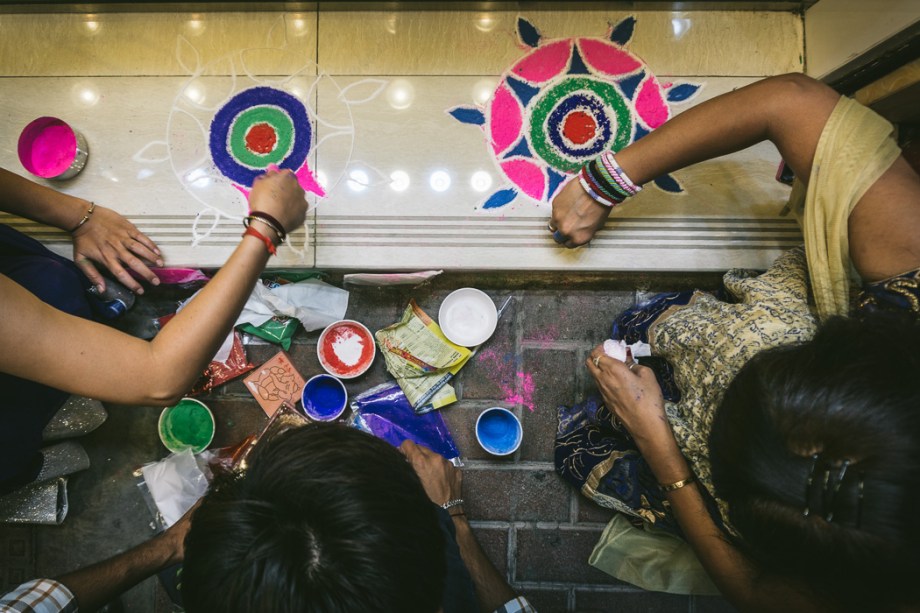 people making rangoli