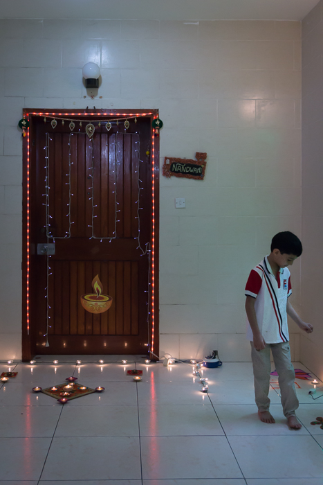 Diwali diyas by a door