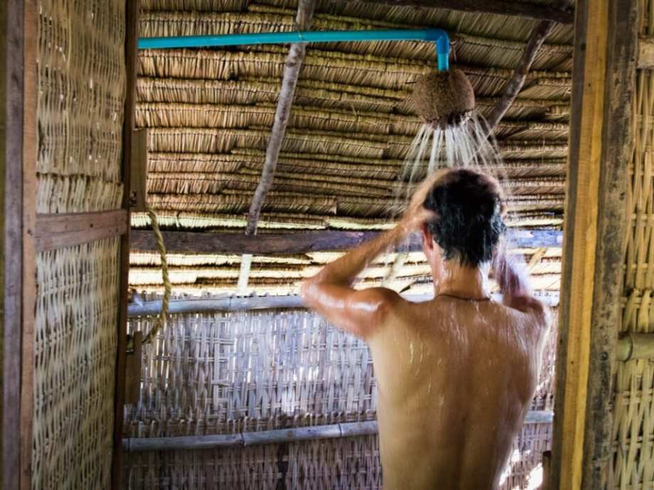 Stephen in shower made of a coconut